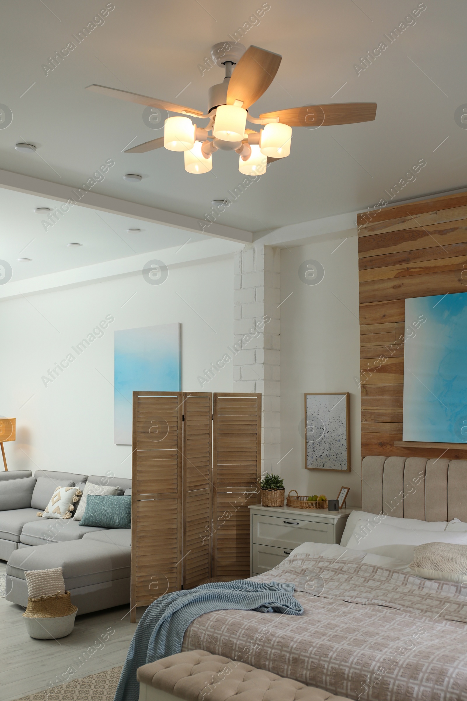 Photo of Stylish apartment interior with modern ceiling fan