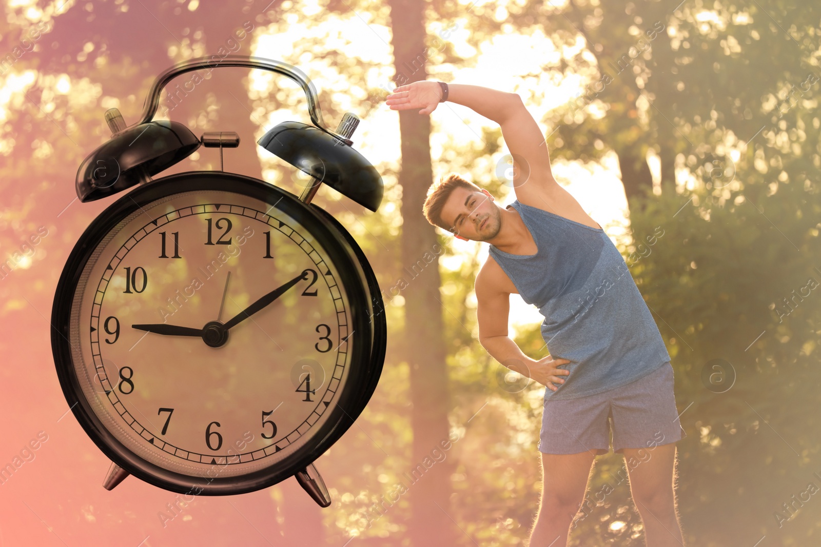 Image of Workout time. Double exposure of man doing exercise on sunny morning in park and alarm clock, color toned