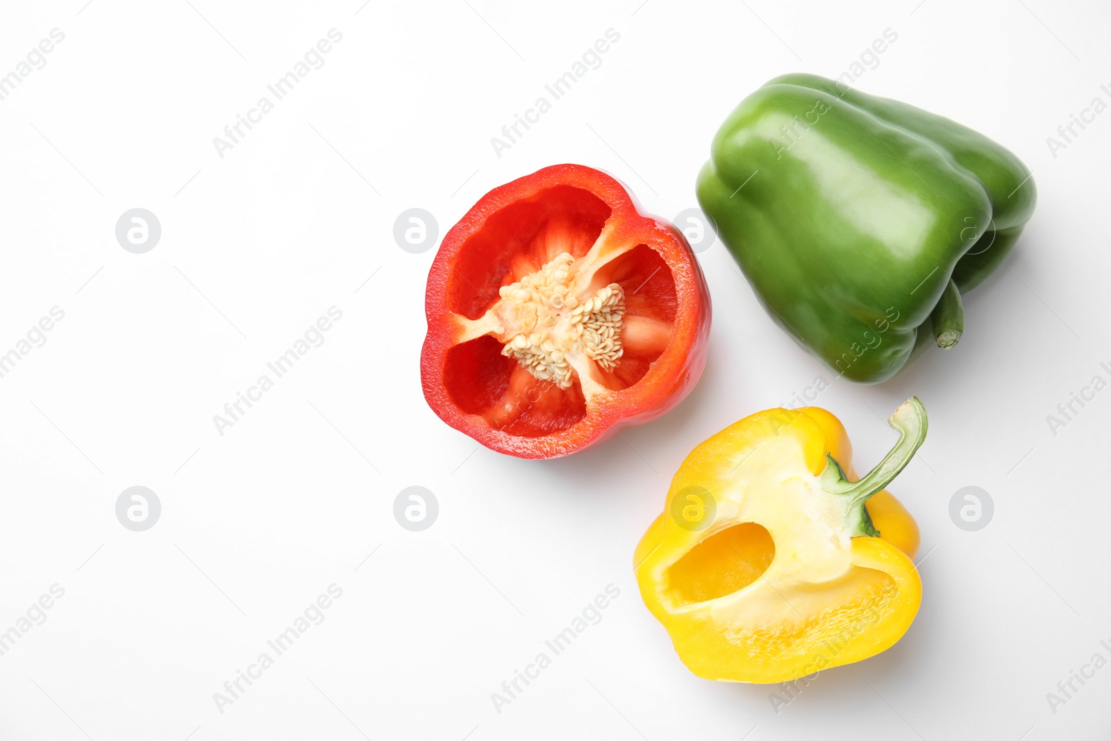 Photo of Raw ripe paprika peppers on white background, top view