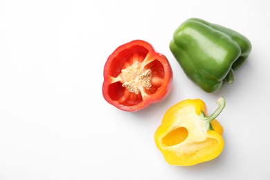 Photo of Raw ripe paprika peppers on white background, top view