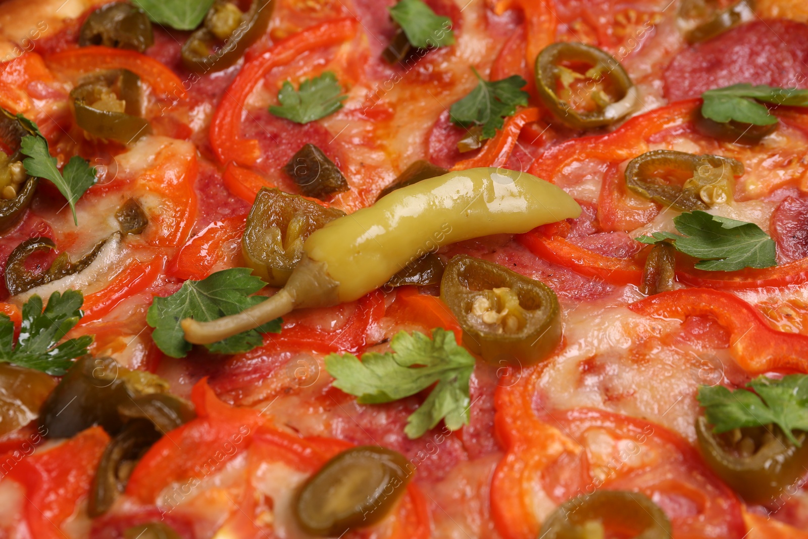 Photo of Delicious hot pizza Diablo as background, closeup