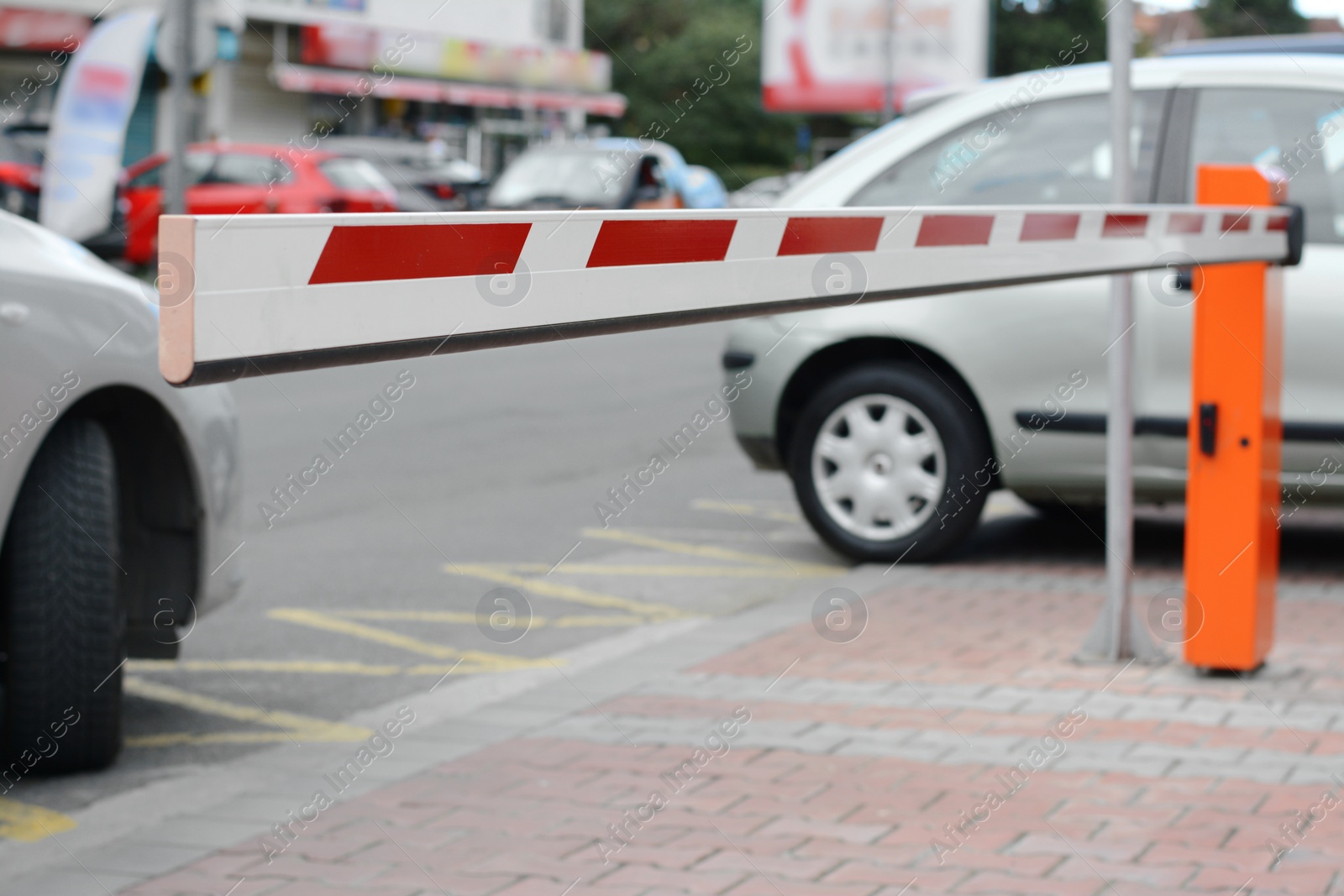 Photo of Automatic closed boom barrier on city street, closeup