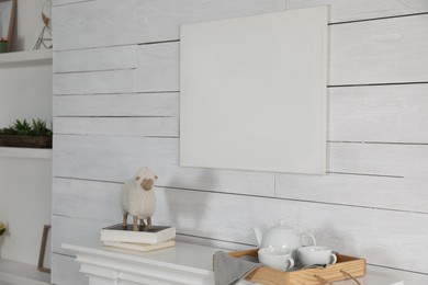 Photo of Stylish living room interior with empty canvas on white wooden wall. Mockup for design