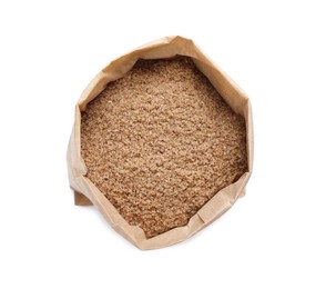 Brown salt in paper bag isolated on white, top view