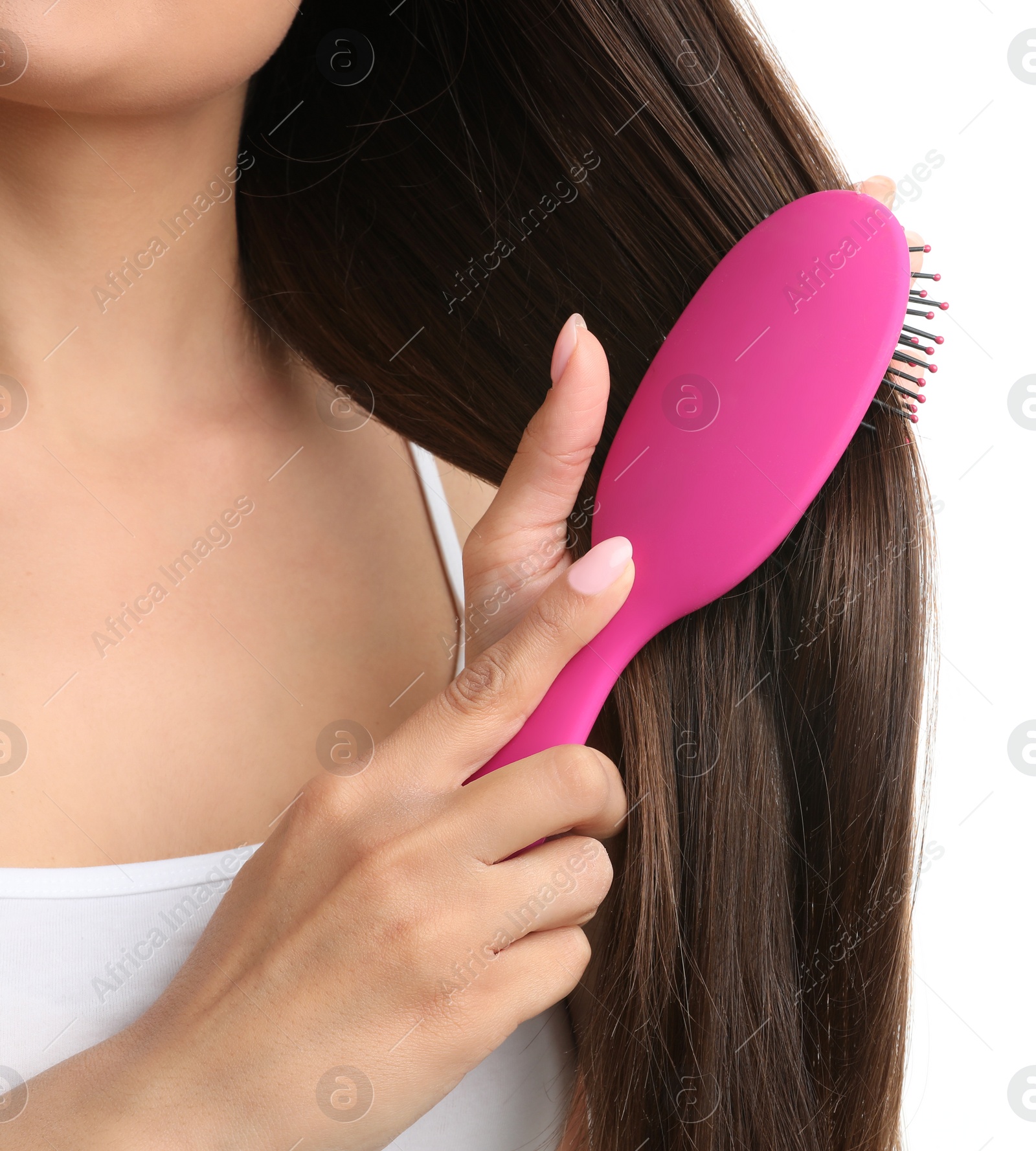 Photo of Woman with hair brush on white background, closeup