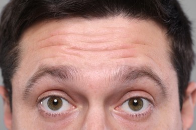 Photo of Closeup view of man with wrinkles on his forehead