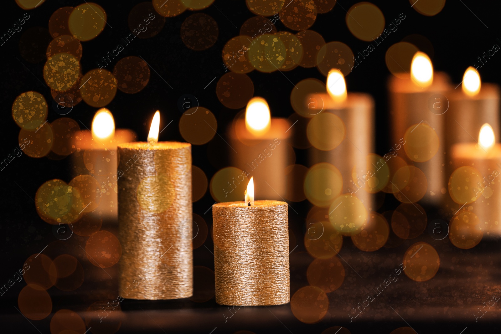 Image of Burning candles on dark background, bokeh effect