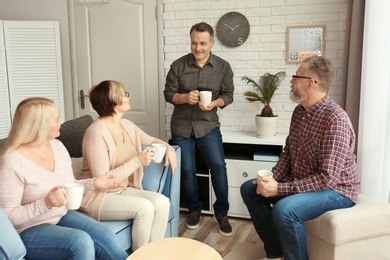 Photo of Happy senior couples spending time together at home