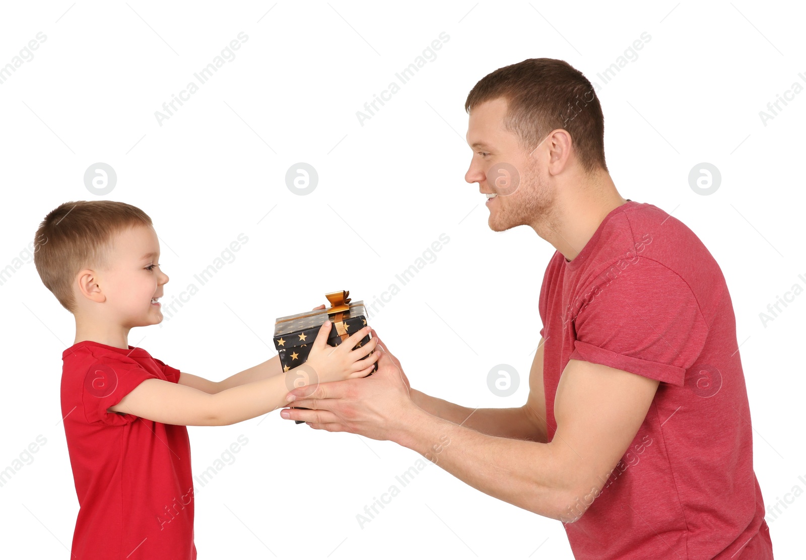 Photo of Man receiving gift for Father's Day from his son on white background