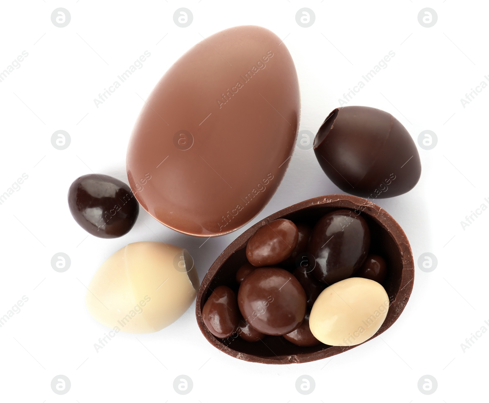 Photo of Tasty chocolate Easter eggs on white background, top view