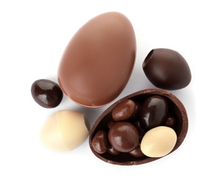 Photo of Tasty chocolate Easter eggs on white background, top view