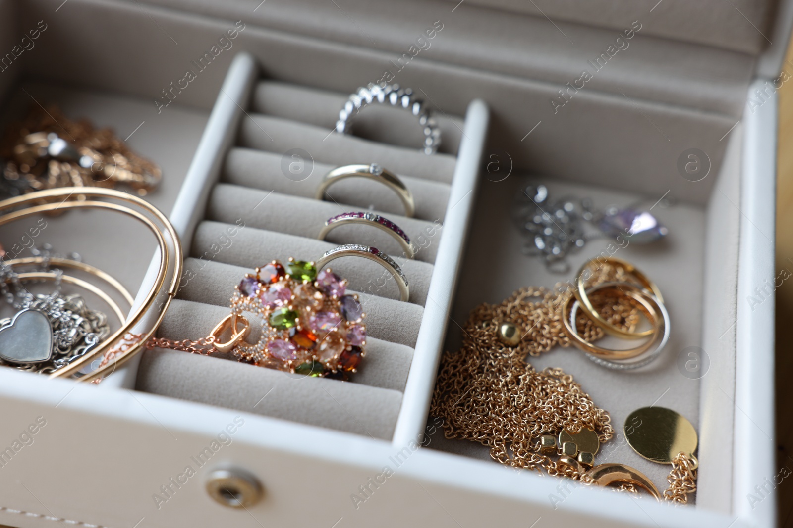 Photo of Jewelry box with many different accessories, closeup