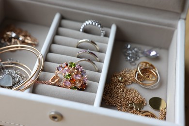 Photo of Jewelry box with many different accessories, closeup