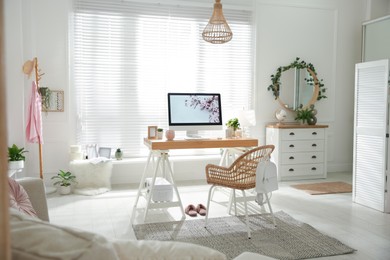 Photo of Stylish home office interior with comfortable workplace