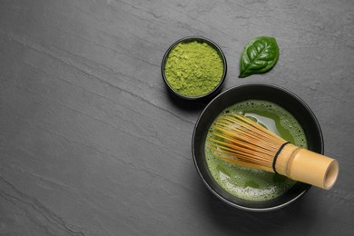 Flat lay composition with matcha tea on gray table. Space for text