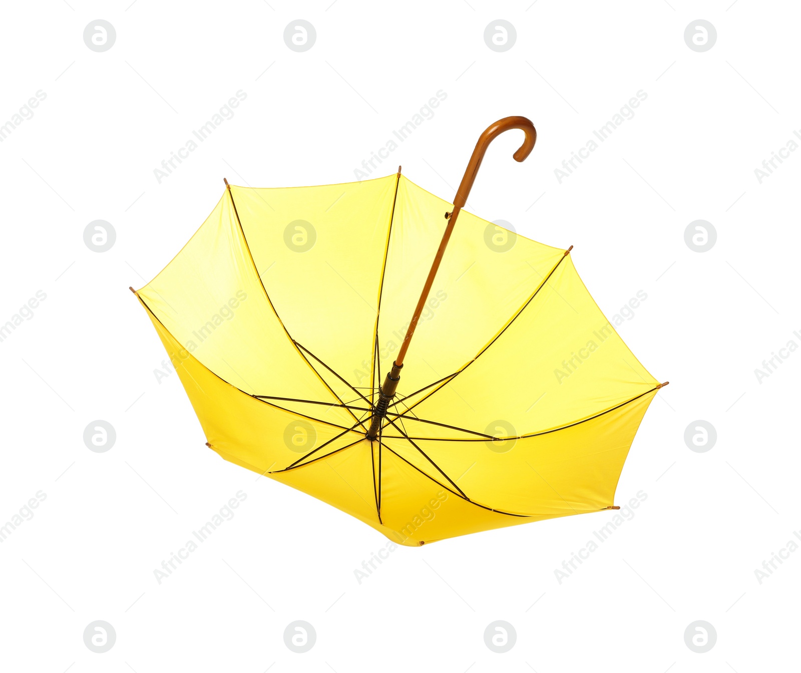 Photo of Modern opened yellow umbrella isolated on white