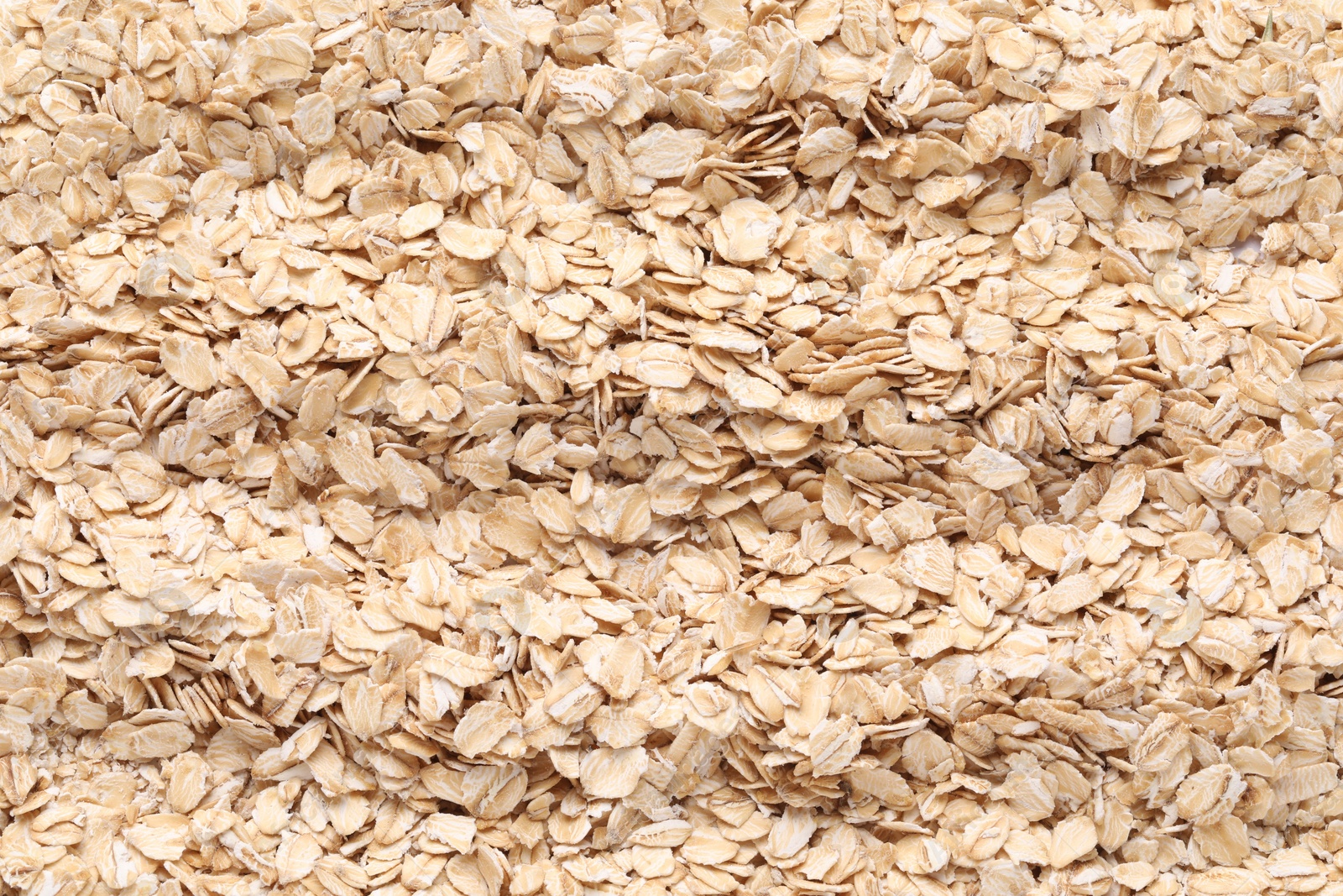 Photo of Top view of rolled oats as background