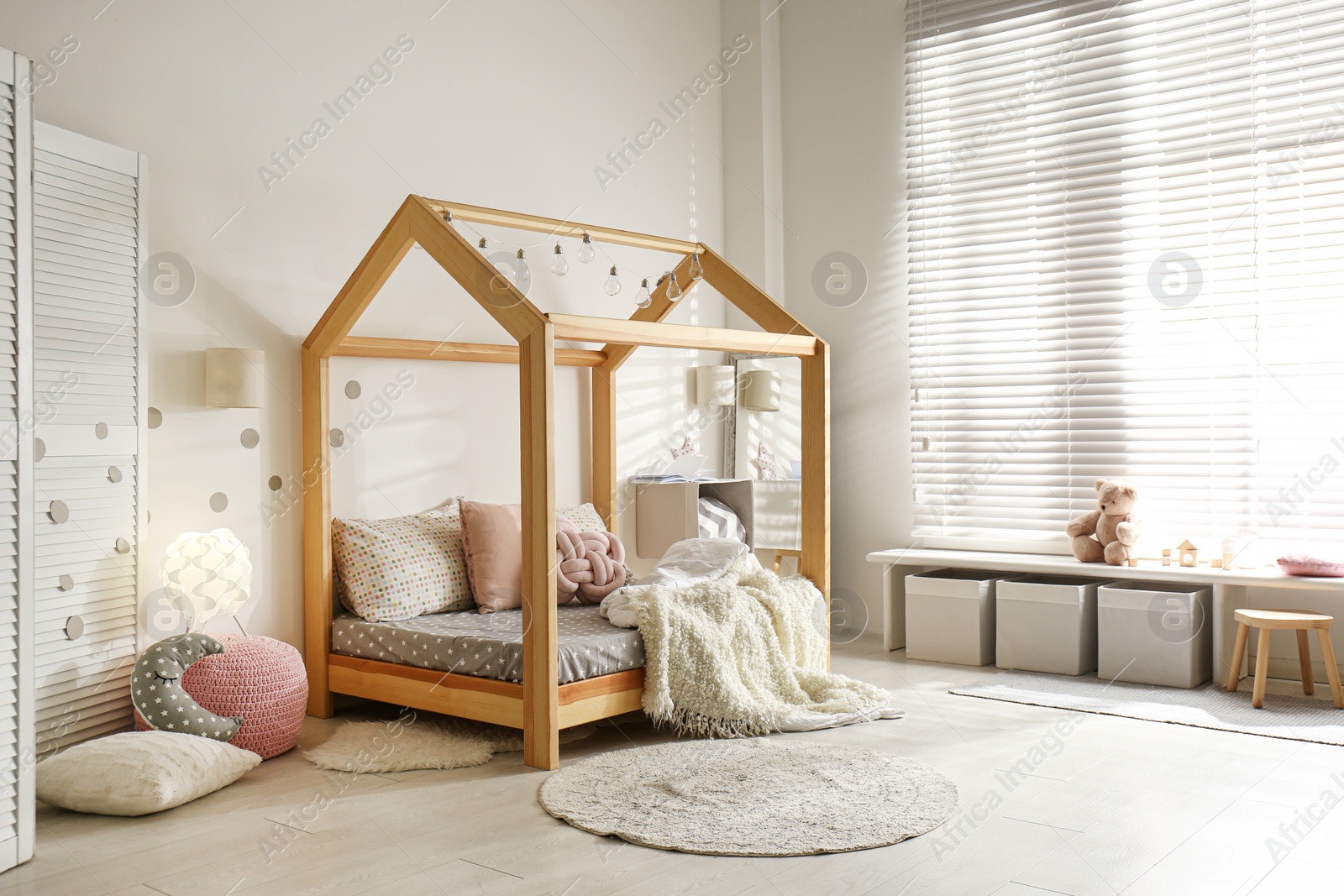 Photo of Cozy child room interior with comfortable bed