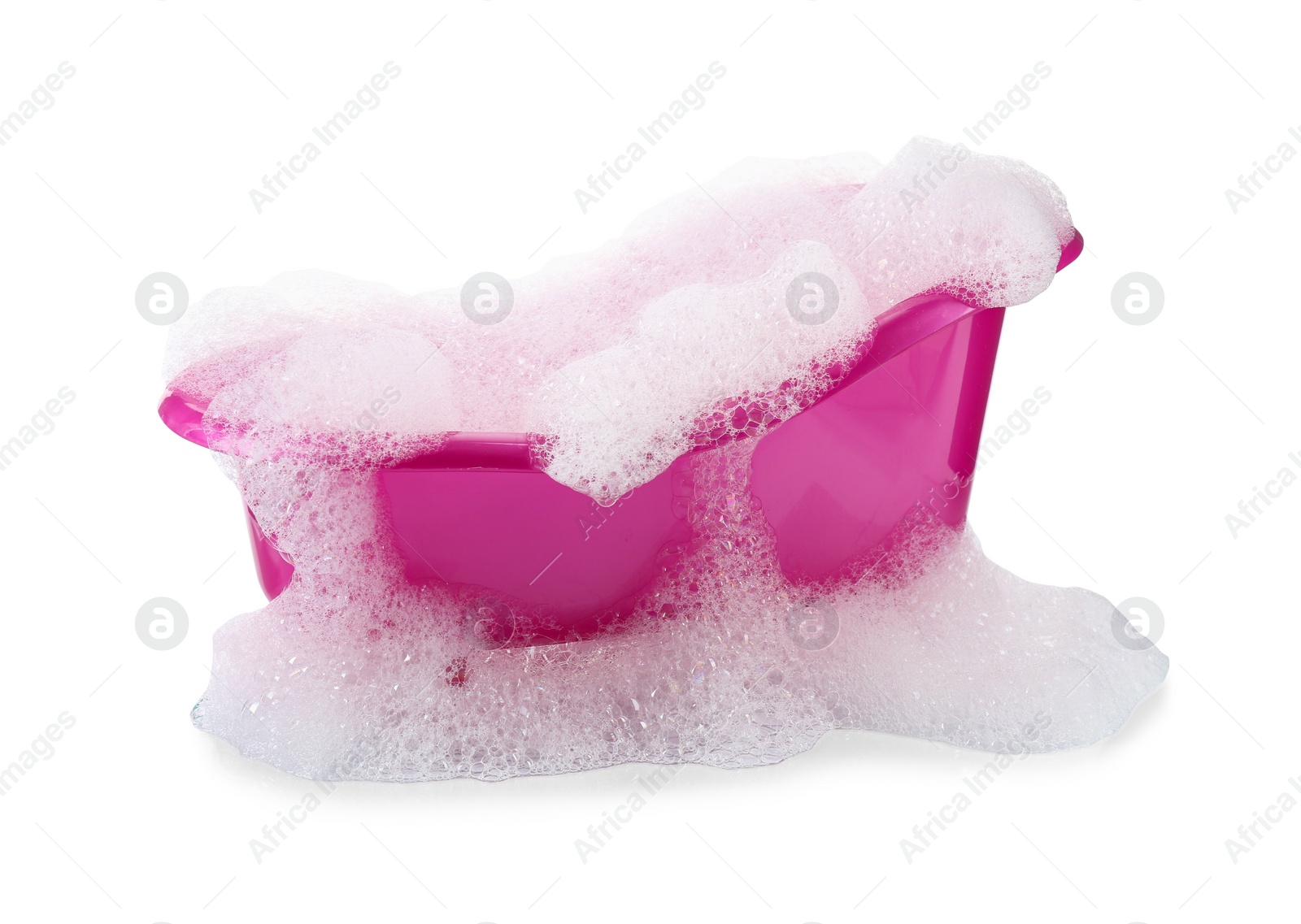 Photo of Pink toy bathtub with foam isolated on white