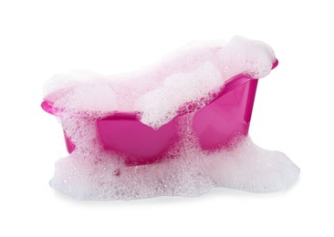 Photo of Pink toy bathtub with foam isolated on white