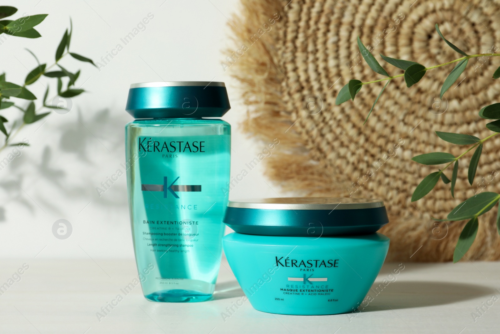 Photo of MYKOLAIV, UKRAINE - SEPTEMBER 07, 2021: Kerastase hair care cosmetic products on white wooden table