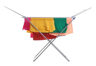 Photo of Clean laundry hanging on drying rack against white background