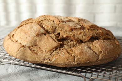 Freshly baked sourdough bread on grey table