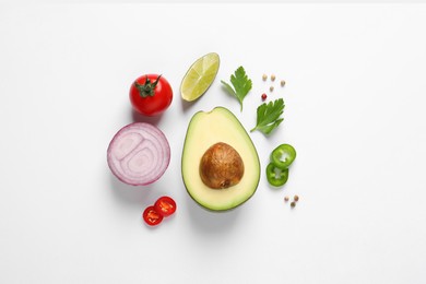 Photo of Fresh ingredients for guacamole on white background, flat lay