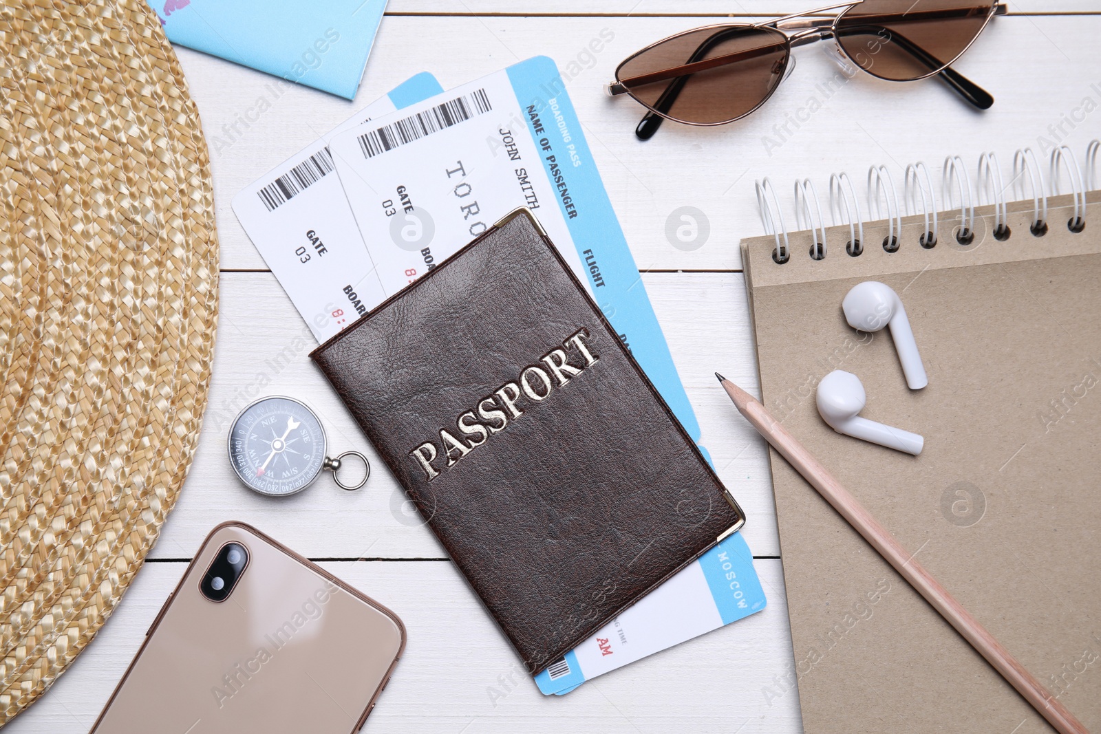 Photo of Flat lay composition with passport and tickets on white wooden table