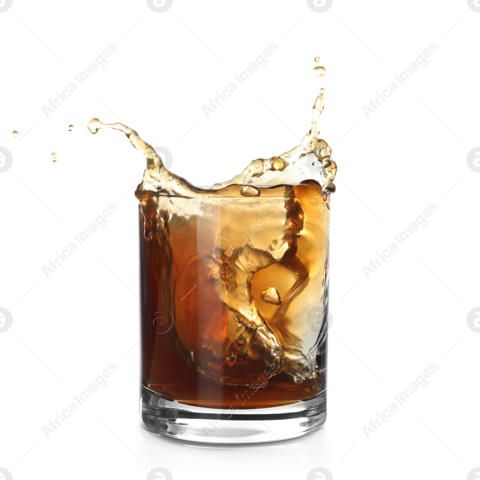 Photo of Glass of expensive whiskey with splash on white background