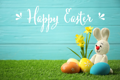 Image of Composition with text Happy Easter and eggs on light blue background