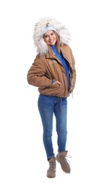 Young woman wearing warm clothes on white background. Ready for winter vacation