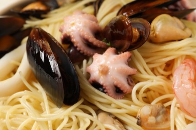 Photo of Delicious pasta with sea food, closeup view