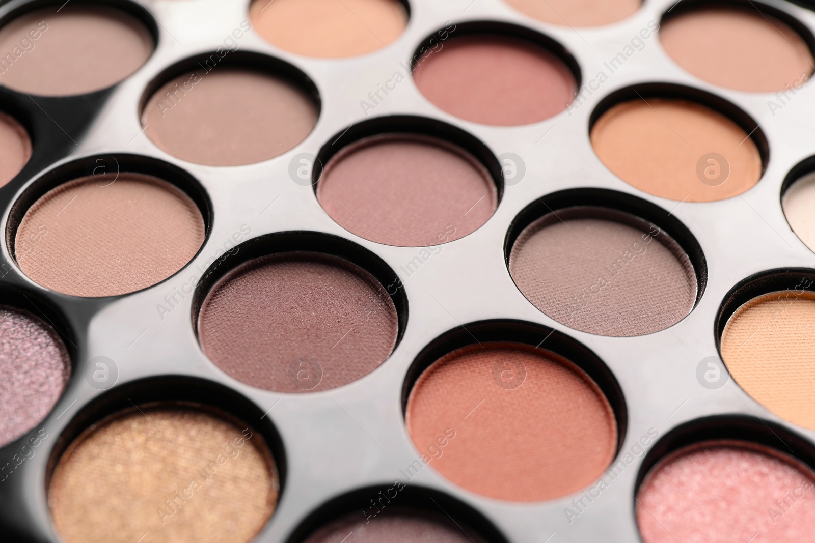 Photo of Beautiful eye shadow palette as background, closeup