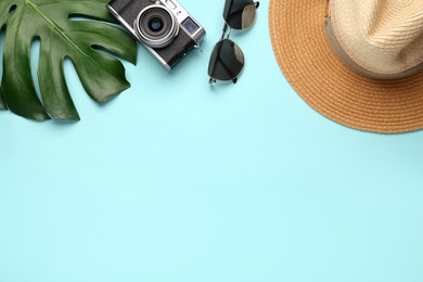 Photo of Flat lay composition with straw hat on turquoise background. Space for text