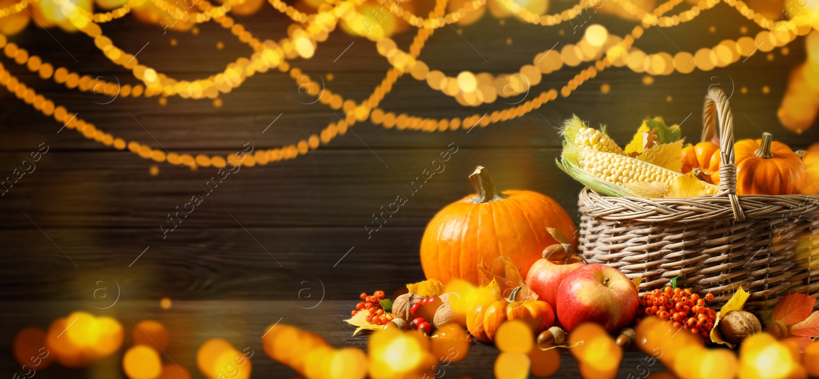 Image of Composition with ripe pumpkins on wooden table, bokeh effect. Happy Thanksgiving day, banner design 