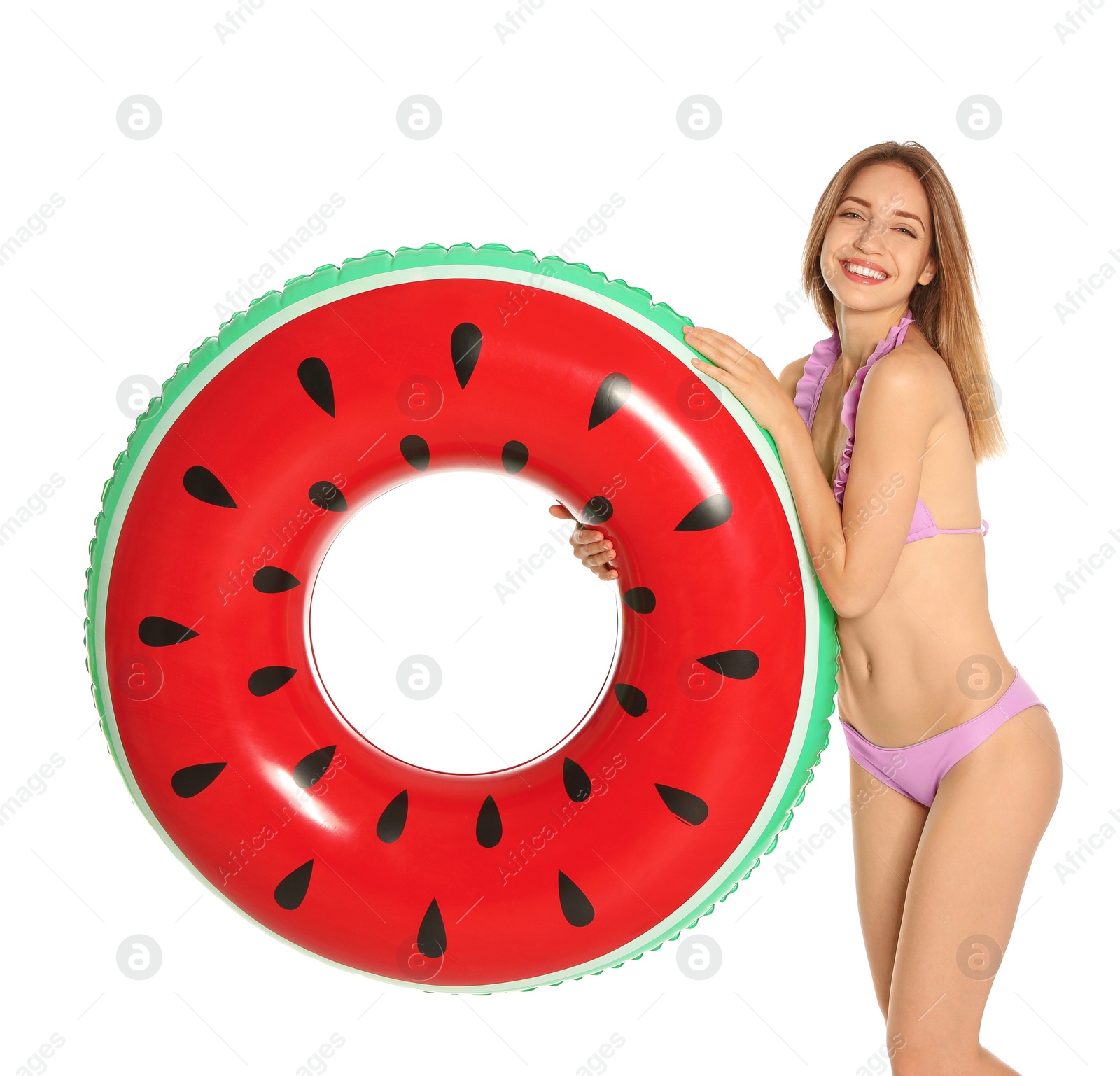 Photo of Beautiful young woman in stylish bikini with watermelon inflatable ring on white background