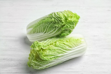 Photo of Fresh ripe cabbages on wooden background