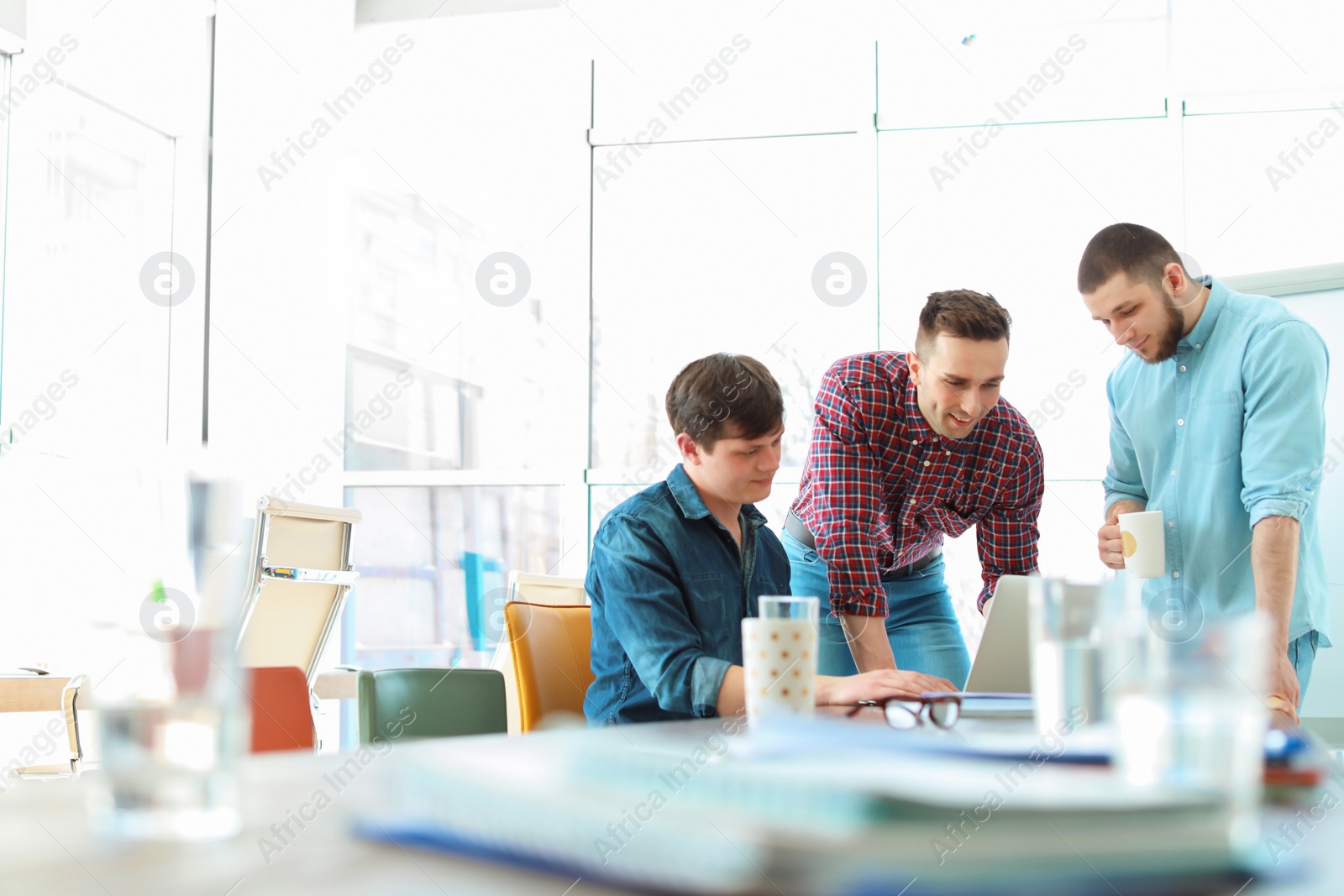 Photo of Young people having business training in office
