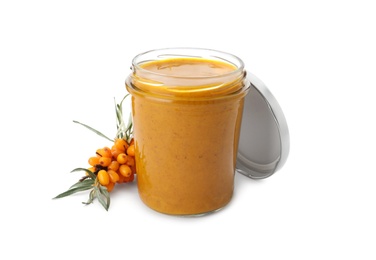 Delicious sea buckthorn jam in jar and fresh berries on white background