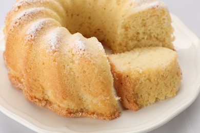 Photo of Delicious freshly baked sponge cake on table, closeup