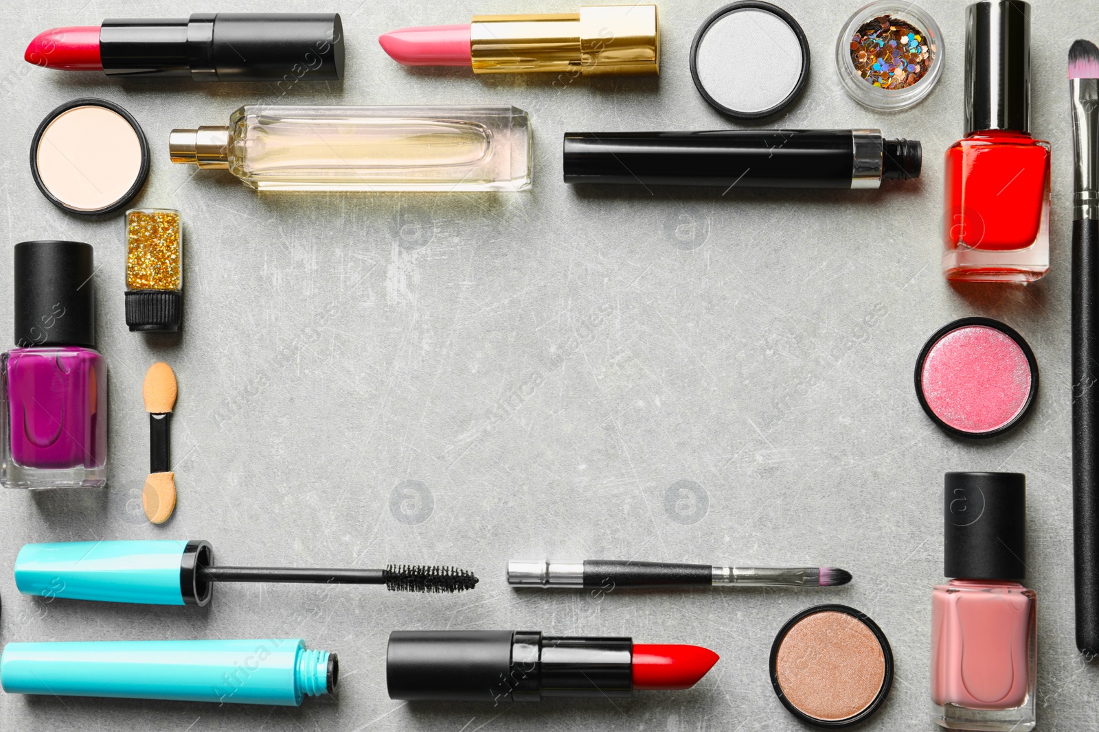 Photo of Flat lay composition with decorative cosmetics on gray background