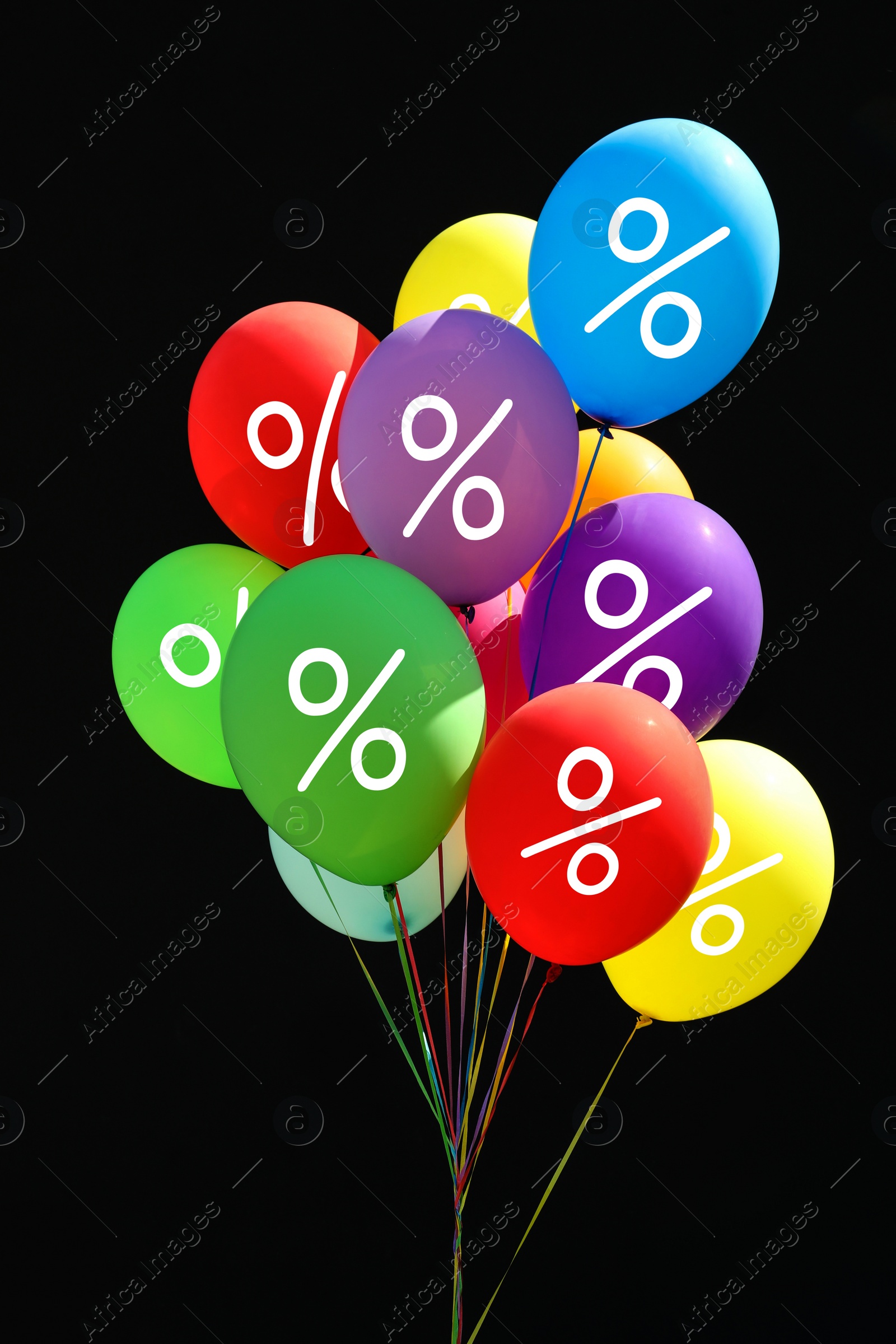 Image of Discount offer. Bunch of balloons with percent signs against black background