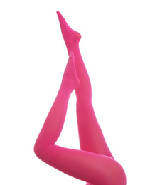 Woman wearing pink tights on white background, closeup of legs