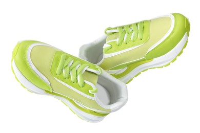 Photo of Pair of stylish light green sneakers on white background