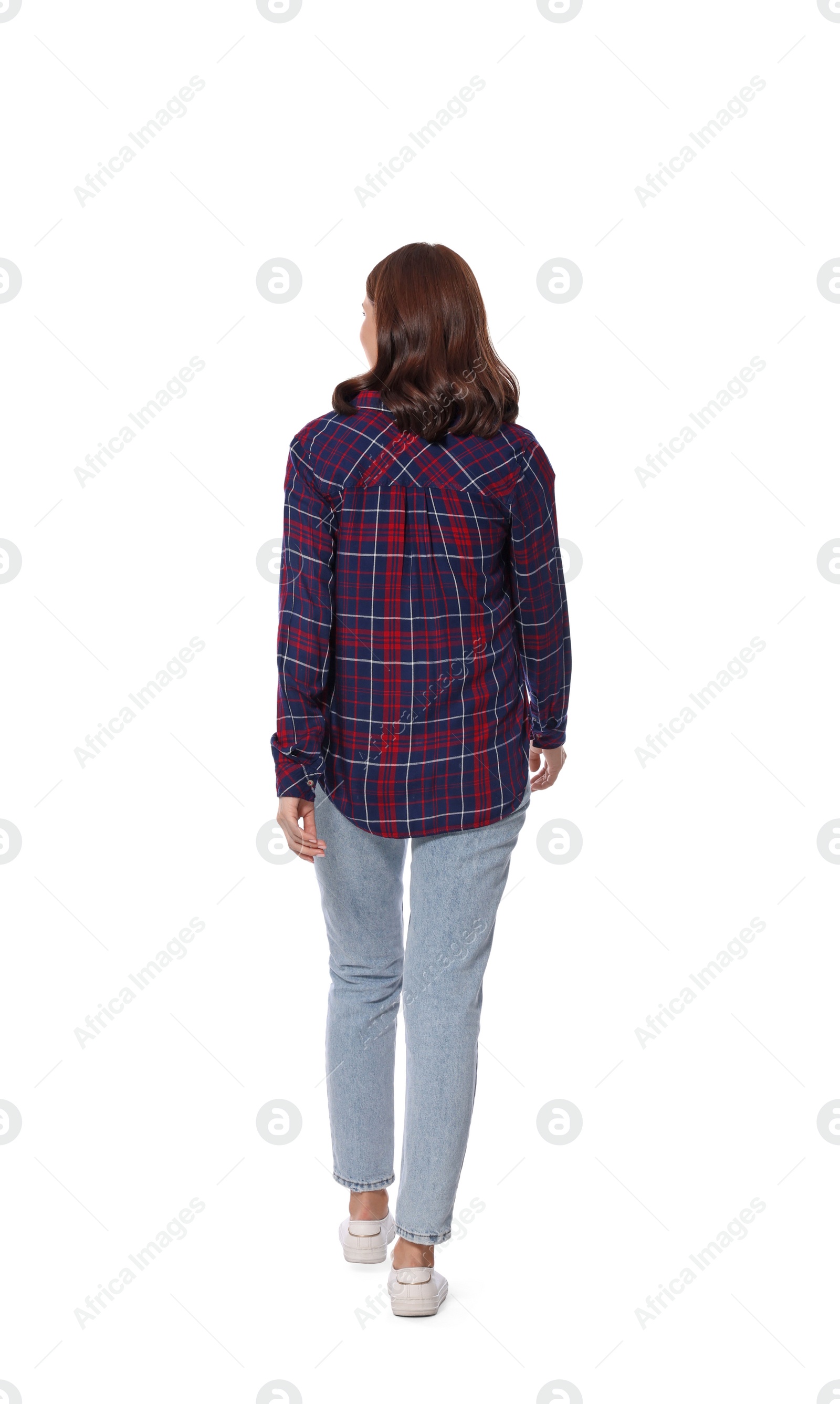 Photo of Woman in casual outfit walking on white background, back view