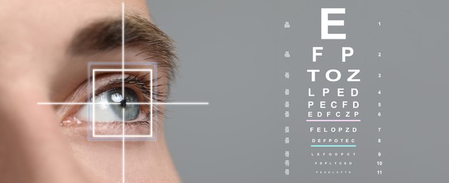 Vision test chart and laser reticle focused on man's eye against light grey background, closeup. Banner design