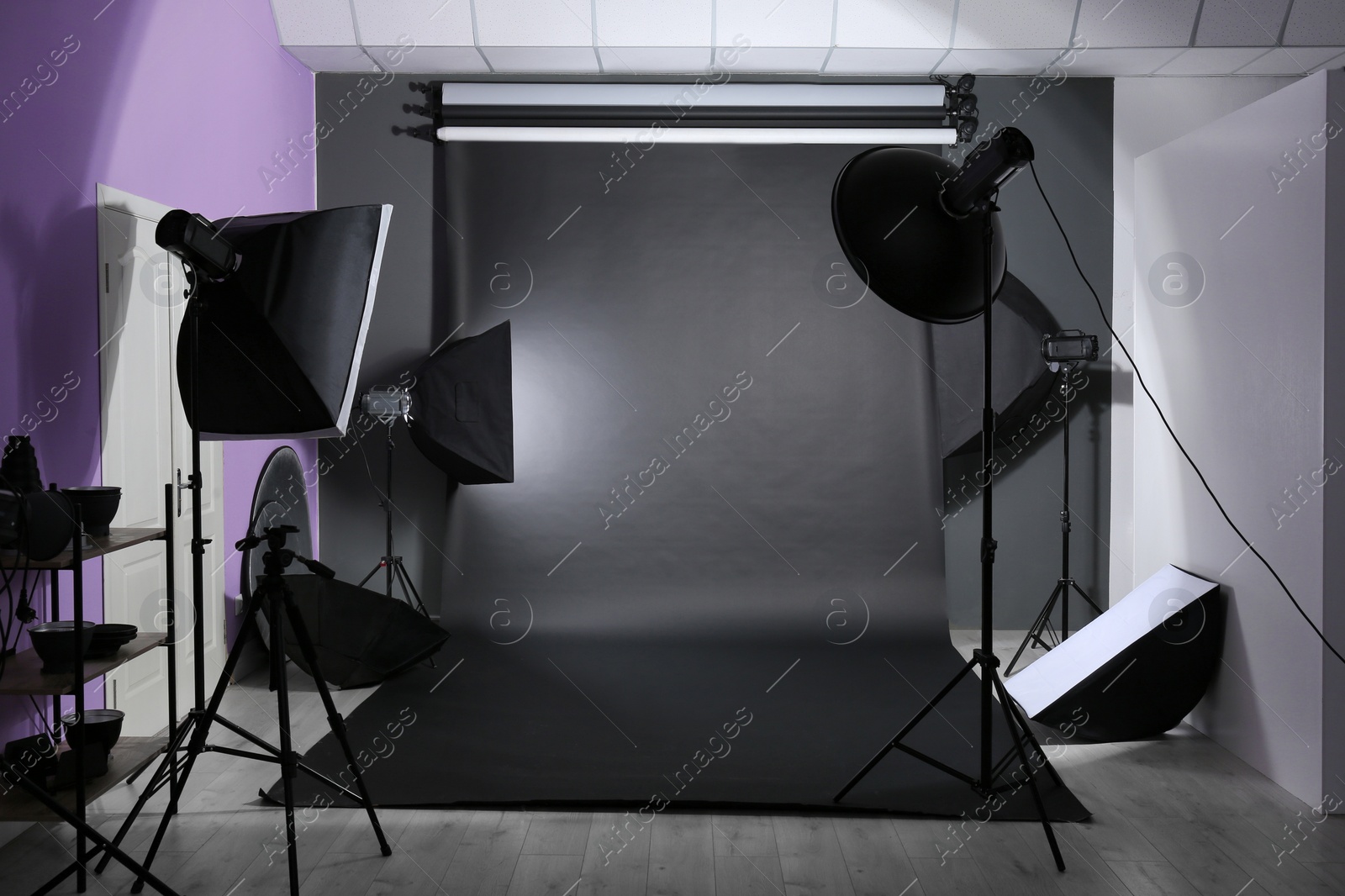 Photo of Interior of modern photo studio with professional equipment