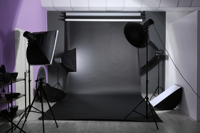 Photo of Interior of modern photo studio with professional equipment