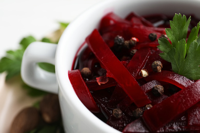 Delicious pickled beets in bowl, closeup view